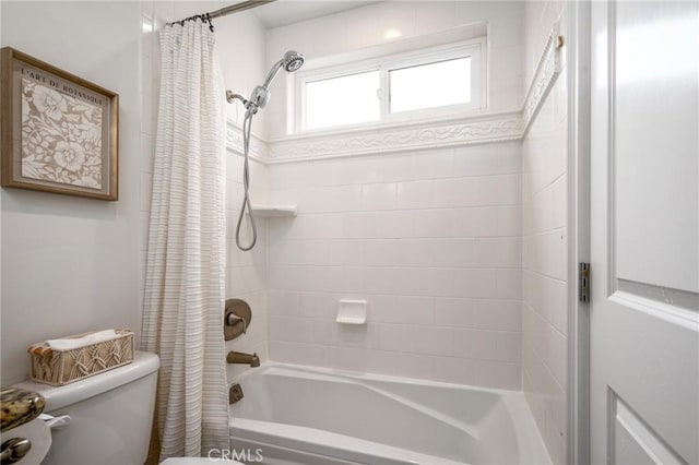 full bathroom featuring toilet and shower / tub combo with curtain