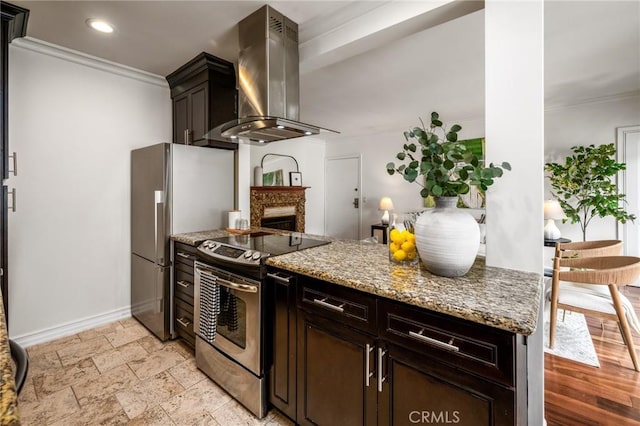 kitchen with ornamental molding, light stone counters, ventilation hood, baseboards, and appliances with stainless steel finishes
