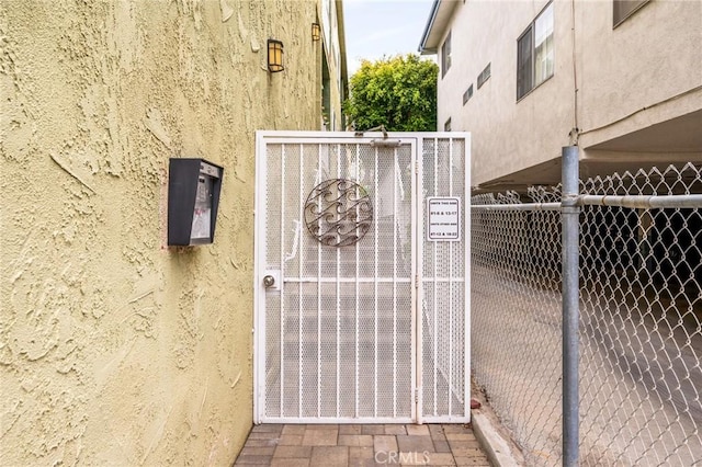 view of gate with fence