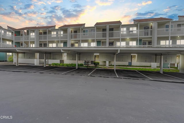 229 S Ventura Rd Unit 105, Port Hueneme, CA 93041 - view of building exterior with covered parking and a residential view
