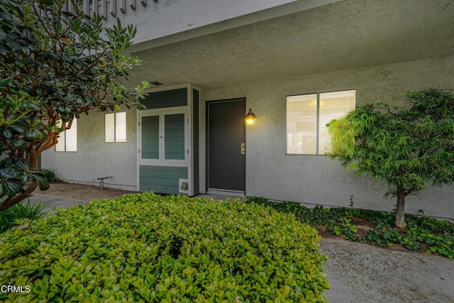 229 S Ventura Rd Unit 105, Port Hueneme, CA 93041 - doorway to property featuring stucco siding