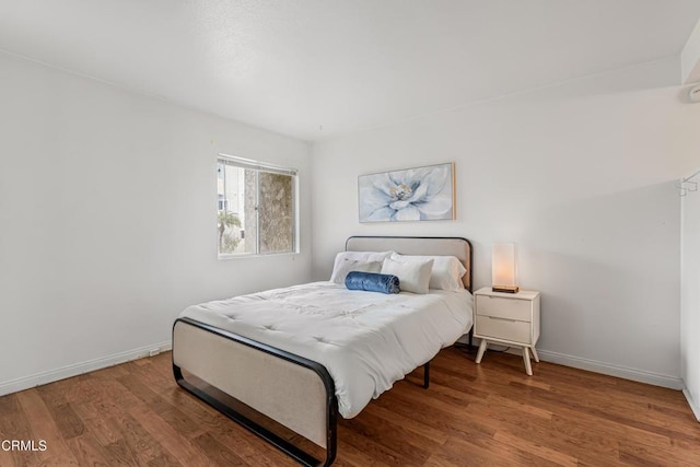 229 S Ventura Rd Unit 105, Port Hueneme, CA 93041 - bedroom featuring wood finished floors and baseboards