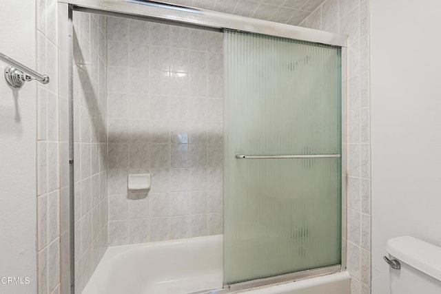 229 S Ventura Rd Unit 105, Port Hueneme, CA 93041 - bathroom featuring toilet and combined bath / shower with glass door