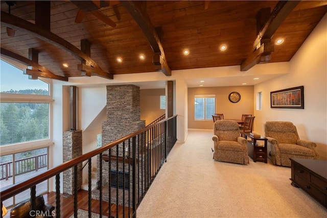sitting room featuring carpet flooring, wood ceiling, an upstairs landing, lofted ceiling with beams, and recessed lighting