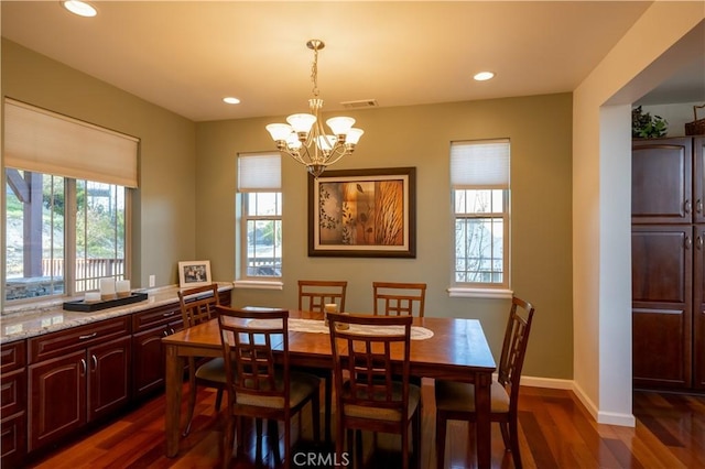 dining space with an inviting chandelier, visible vents, dark wood-style flooring, and recessed lighting