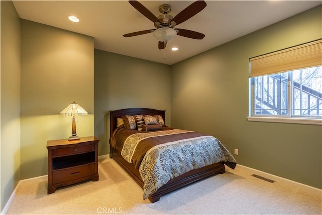 bedroom with light colored carpet, baseboards, visible vents, and recessed lighting