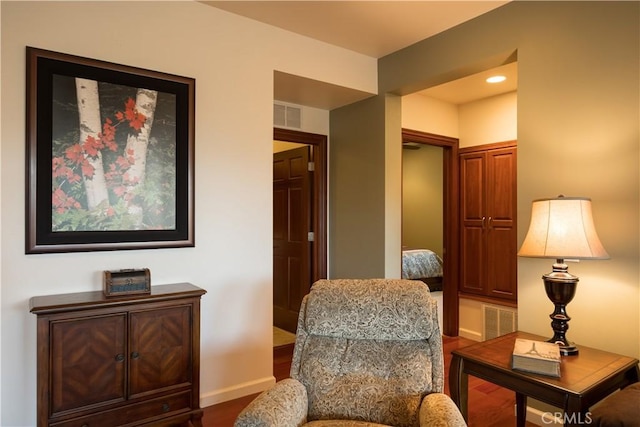 sitting room featuring recessed lighting, baseboards, visible vents, and wood finished floors