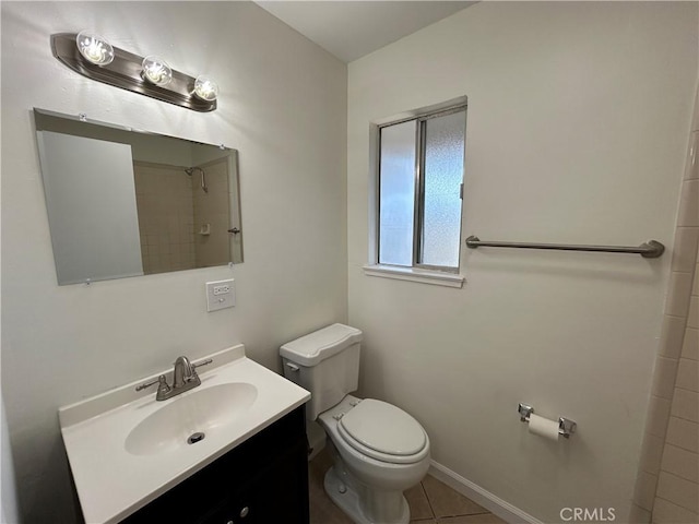 6917 Stillwater Way, Sacramento, CA 95828 - bathroom with toilet, vanity, tile patterned flooring, baseboards, and a tile shower