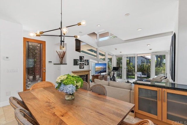 1407 Ocean, Del Mar, CA 92014 - dining space featuring recessed lighting, a chandelier, french doors, and a glass covered fireplace