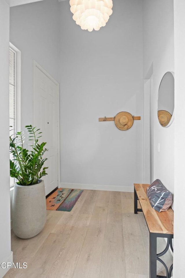 1323 Bayside Cir, Oxnard, CA 93035 - foyer with wood finished floors, a high ceiling, a chandelier, and baseboards