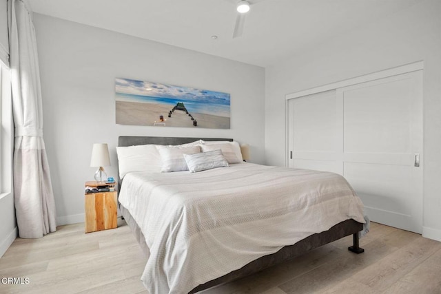 1323 Bayside Cir, Oxnard, CA 93035 - bedroom featuring light wood-style floors, a closet, baseboards, and a ceiling fan