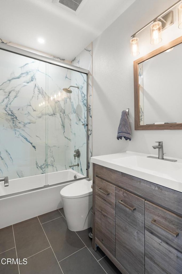 1323 Bayside Cir, Oxnard, CA 93035 - full bath with vanity, enclosed tub / shower combo, toilet, and tile patterned flooring