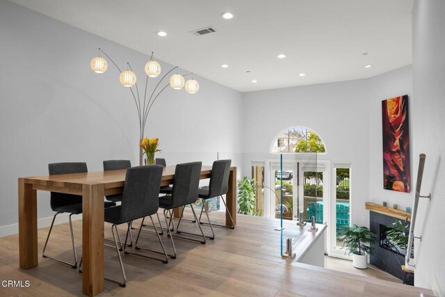 1323 Bayside Cir, Oxnard, CA 93035 - dining space featuring wood finished floors, recessed lighting, and a towering ceiling