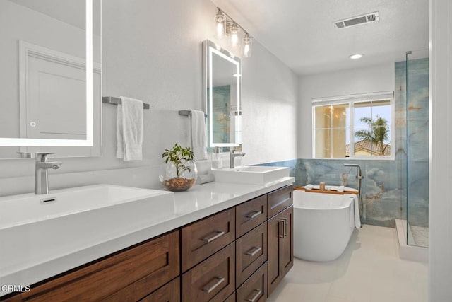 1323 Bayside Cir, Oxnard, CA 93035 - bathroom featuring double vanity, a soaking tub, and a stall shower