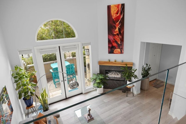 1323 Bayside Cir, Oxnard, CA 93035 - interior space featuring a towering ceiling, wood finished floors, healthy amount of natural light, french doors, and a premium fireplace