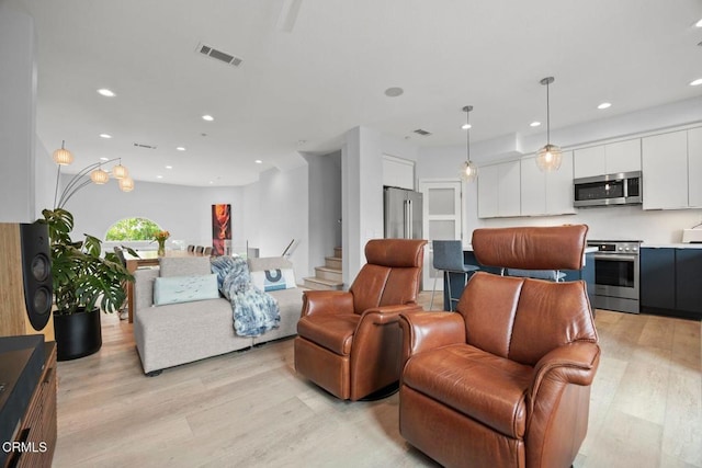 1323 Bayside Cir, Oxnard, CA 93035 - living area featuring light wood finished floors and recessed lighting
