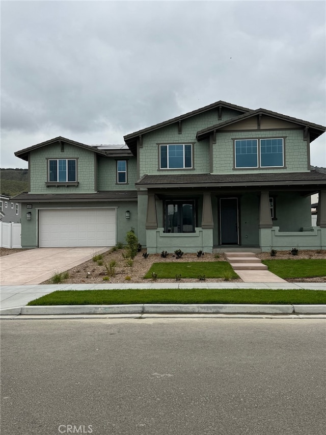 view of front of property featuring a garage and driveway