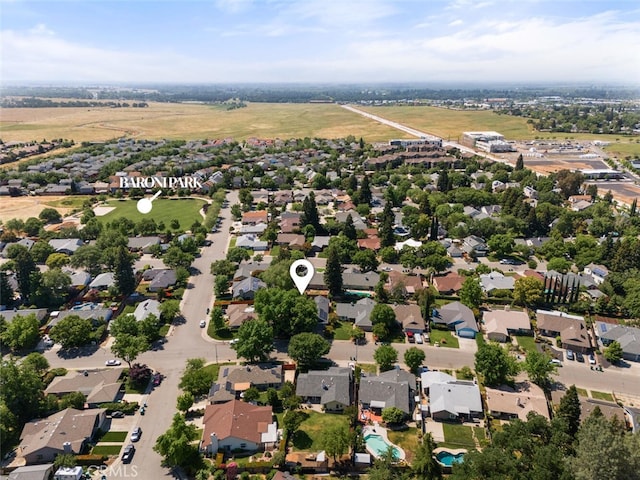 birds eye view of property with a residential view