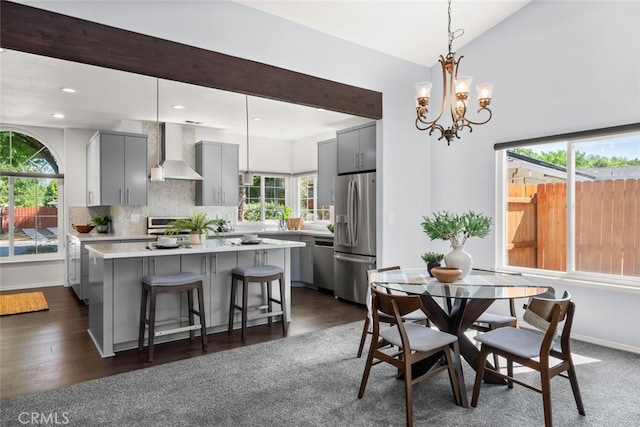 dining room featuring recessed lighting, dark wood-style flooring, baseboards, and a notable chandelier