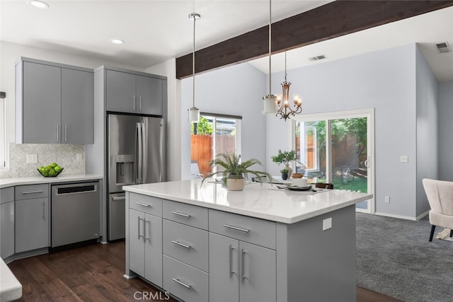 kitchen featuring gray cabinets, appliances with stainless steel finishes, visible vents, backsplash, and vaulted ceiling with beams