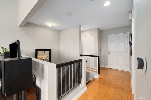 15796 Midwood Dr Unit 6, Granada Hills, CA 91344 - corridor featuring an upstairs landing, recessed lighting, light wood finished floors, and baseboards