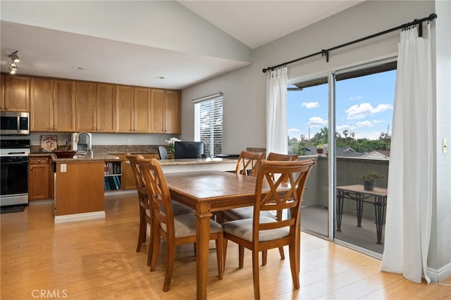 15796 Midwood Dr Unit 6, Granada Hills, CA 91344 - dining space featuring vaulted ceiling and light wood finished floors