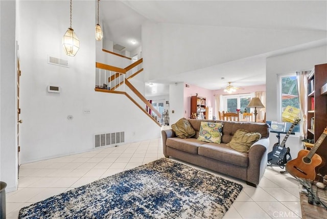 36 Westbrook Ln, Pomona, CA 91766 - tiled living room with stairway, a ceiling fan, and high vaulted ceiling