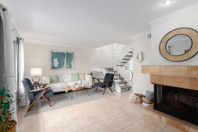 827 Del Mar Downs Rd Unit E, Solana Beach, CA 92075 - living room featuring crown molding, stairs, light tile patterned floors, and a fireplace