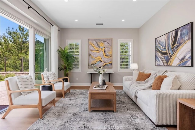 149 Fairgreen, Irvine, CA 92618 - living area featuring wood finished floors, plenty of natural light, recessed lighting, and baseboards