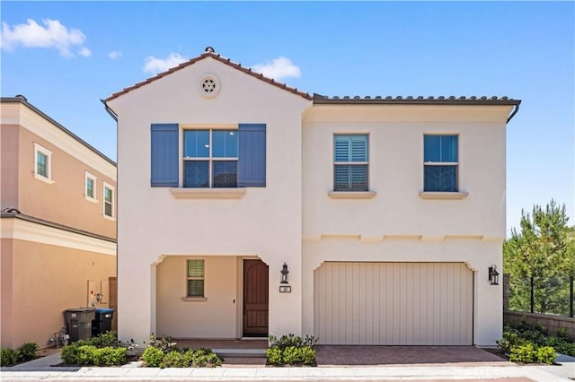149 Fairgreen, Irvine, CA 92618 - mediterranean / spanish-style home featuring stucco siding, an attached garage, a tile roof, and driveway
