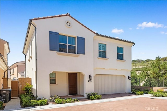 149 Fairgreen, Irvine, CA 92618 - view of front of property featuring stucco siding, fence, a garage, decorative driveway, and a tiled roof