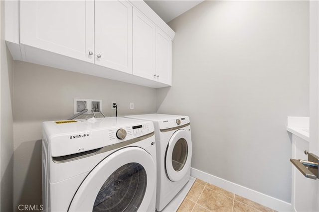 149 Fairgreen, Irvine, CA 92618 - washroom featuring cabinet space, washer and clothes dryer, baseboards, and light tile patterned flooring