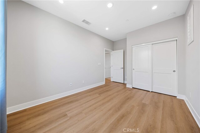 149 Fairgreen, Irvine, CA 92618 - unfurnished bedroom featuring light wood-type flooring, recessed lighting, baseboards, and a closet