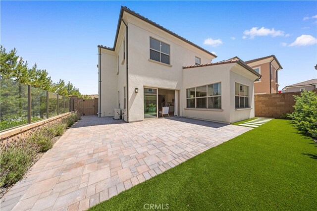 149 Fairgreen, Irvine, CA 92618 - rear view of house featuring stucco siding and a patio
