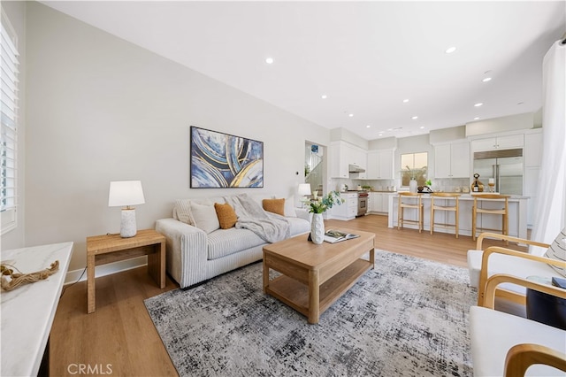 149 Fairgreen, Irvine, CA 92618 - living room with light wood-style flooring, recessed lighting, and baseboards