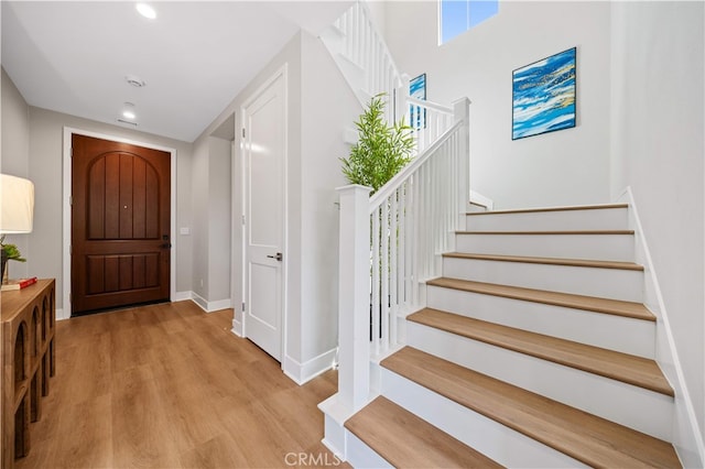 149 Fairgreen, Irvine, CA 92618 - foyer entrance featuring stairway, wood finished floors, baseboards, and recessed lighting