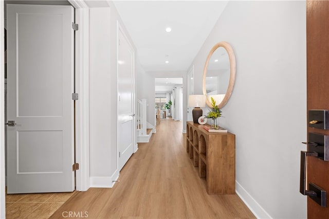 149 Fairgreen, Irvine, CA 92618 - hallway with light wood finished floors, baseboards, and recessed lighting
