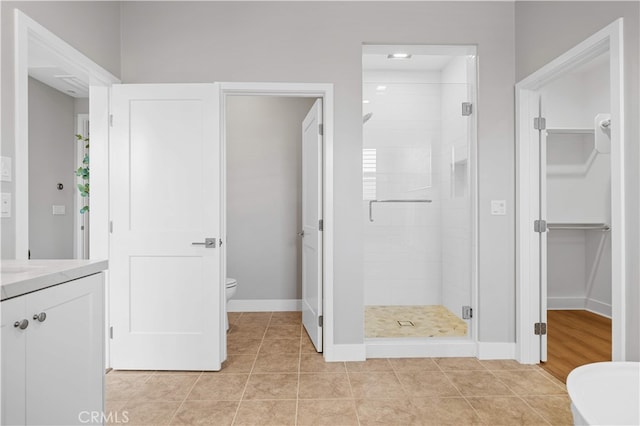 149 Fairgreen, Irvine, CA 92618 - bathroom with a shower stall, toilet, baseboards, vanity, and tile patterned floors