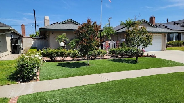 ranch-style home with an attached garage, driveway, and a chimney