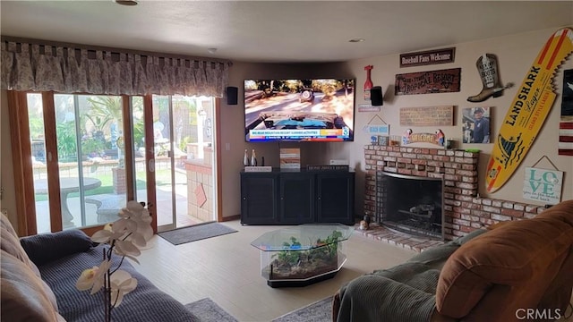 living room with wood finished floors and a fireplace