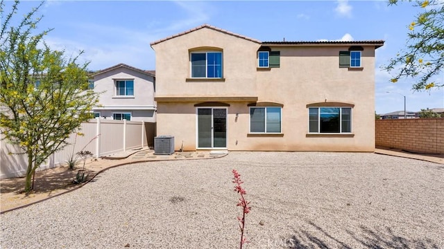 back of property featuring a fenced backyard and stucco siding