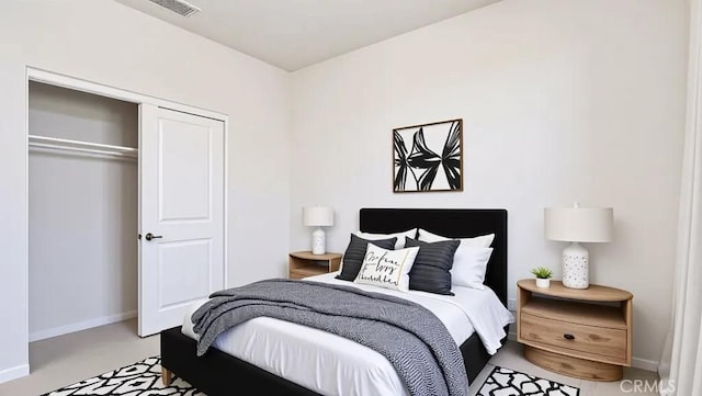 bedroom with a closet and baseboards