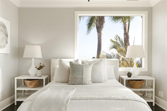bedroom featuring baseboards and ornamental molding