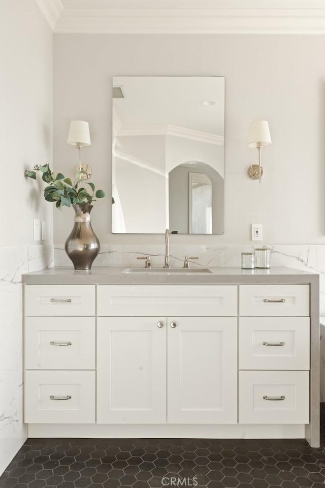 bathroom featuring vanity and ornamental molding