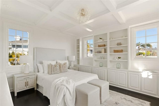 bedroom with multiple windows, beam ceiling, coffered ceiling, and dark wood-type flooring