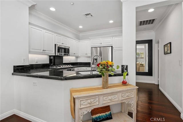 94 Paseo Vis, San Clemente, CA 92673 - kitchen featuring ornamental molding, stainless steel appliances, visible vents, and dark wood finished floors