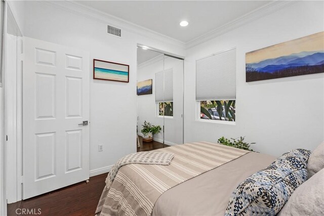 94 Paseo Vis, San Clemente, CA 92673 - bedroom with a closet, baseboards, visible vents, crown molding, and wood finished floors