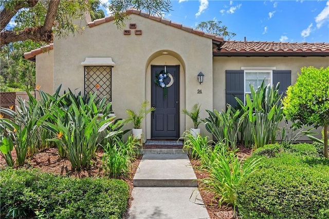 94 Paseo Vis, San Clemente, CA 92673 - doorway to property with stucco siding and a tiled roof