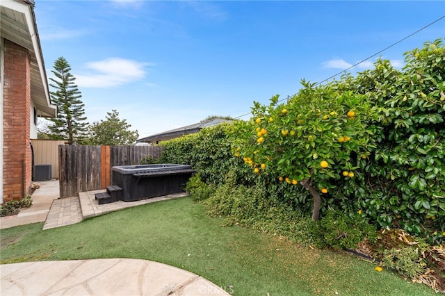 13402 Wheeler, North Tustin, CA 92705 - view of yard featuring a hot tub, a patio area, a fenced backyard, and central AC unit