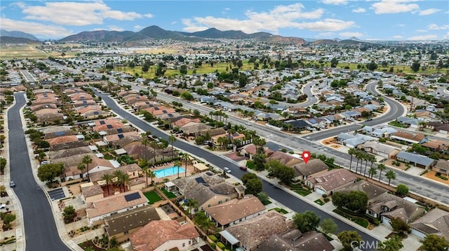 drone / aerial view featuring a residential view and a mountain view